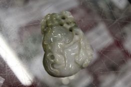 A Chinese carved jade amulet / pebble.