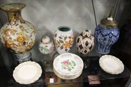 A collection of porcelain items to include ginger jars and covers, blue and white temple jar etc.