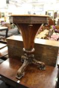 A 19th century rosewood octagonal shaped work table on carved tripod base.