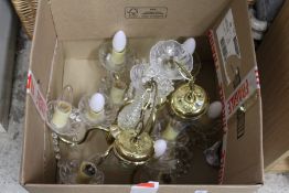 A pair of cut glass and brass chandeliers.