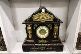 A large Victorian slate mantle clock.