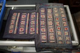 A Chinese embroidered silk baby carrier.