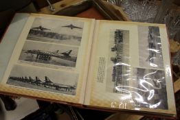 A large quantity of photograph albums containing numerous photos of aeroplanes.