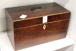 A George III mahogany tea caddy with fitted interior.