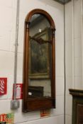 A Victorian mahogany arch topped mirror.