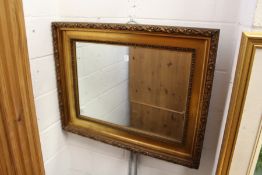 A decorative gilt framed mirror.