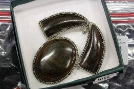 A horn mounted brooch.