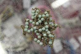 A silver and bead necklace.