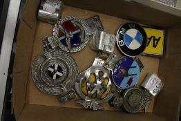 Various car badges.