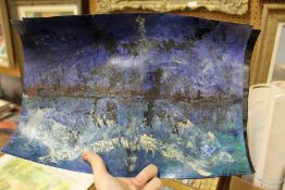 A small group of unframed posters.