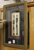Two African figures, framed and glazed.