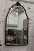 A small mahogany mirror.