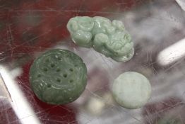 Three small Chinese carved jade items.