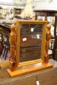 A modern pine dressing table mirror.