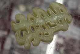 A Chinese carved jade symbol.