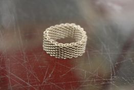 A Tiffany woven silver ring.