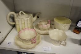 A Belleek porcelain faux bamboo teapot and other Belleek porcelain.