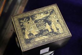 A Chinese lacquer box with gilded decoration.