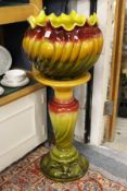 A large Bretby Pottery jardiniere and stand.