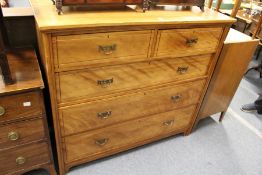 A Victorian satin walnut chest of drawers.