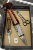 A pair of topiary shears, grape cutting scissors and flower arranging scissors.
