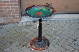 A metal bird bath.
