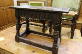 An Elizabethan style oak joynt stool.