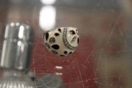 A silver and enamel ring.