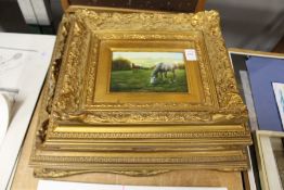 Three decorative paintings with ornate gilt frames.
