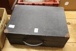 A portable gramophone and records.