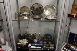 A large quantity of silver plate and pewter items.