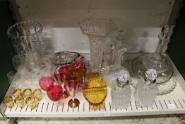 A pair of cut glass decanters with metal mounts possibly silver together with cut glass vases and