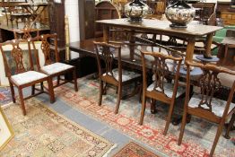 Two sets of six Georgian style mahogany dining chairs to include a pair of carver chairs.