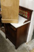 A Victorian walnut small marble top wash stand with tiled back splash.