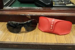 A cased set of Prada sunglasses.