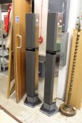 A pair of Bang & Olufsen tall column shaped speakers.