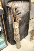 A bag of early golf clubs.