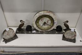 An Art Deco marble clock garniture.