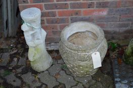 A reconstituted stone garden pot and a pot stand.
