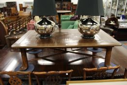 An unusual elm and bamboo large low table with folding X-shaped frame.