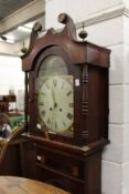 A 19th century mahogany eight-day long case clock with painted arched dial.