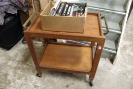 A teak two tier tea trolley.