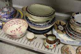A shelf of decorative china.