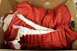 A large crimson coloured door curtain.