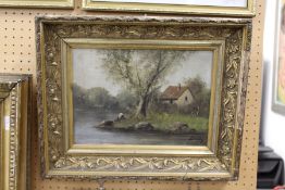 'Rural River Landscape with a Cottage' oil on canvas, in a decorative gilt frame.