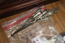 Silver handled button hooks.