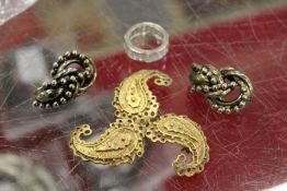 A decorative brooch and other items.