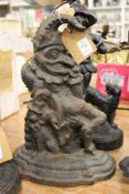 A cast iron Mr Punch door stop.