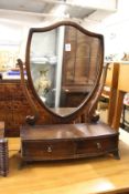 A shield shaped dressing table mirror.