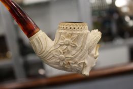 A cased Meerschaum pipe.